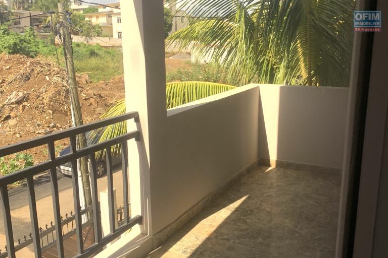 Flic en Flac for rent recent 2 bedroom duplex located 5 minutes walk from shops and the beach in a quiet area .