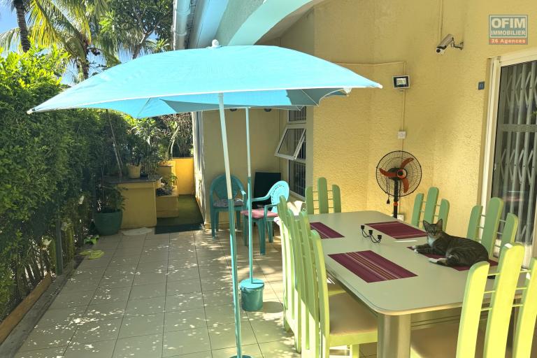 Flic en Flac for sale 3 bedroom triplex located in a beautiful secure residence with 2 large swimming pools and garage, close to amenities and the beach.