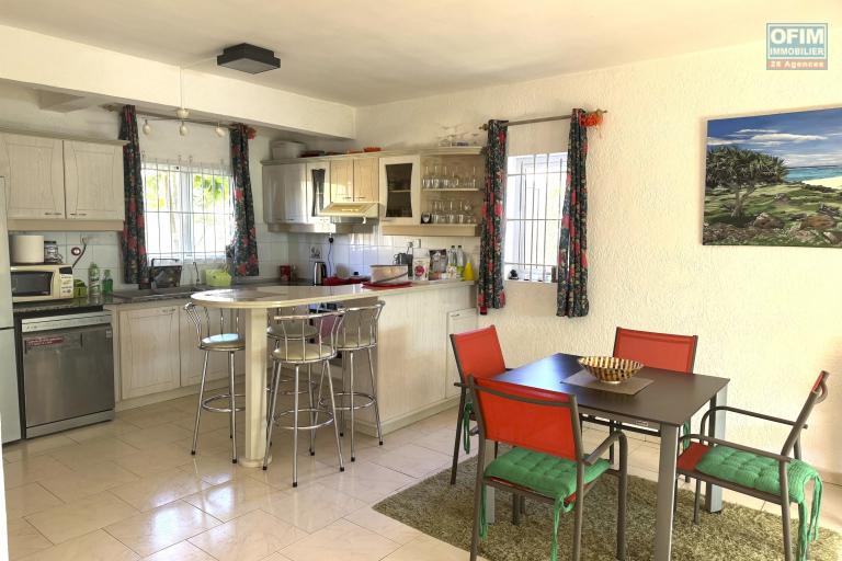 Flic en Flac for sale 3 bedroom triplex located in a beautiful secure residence with 2 large swimming pools and garage, close to amenities and the beach.