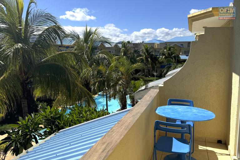 Flic en Flac for sale 3 bedroom triplex located in a beautiful secure residence with 2 large swimming pools and garage, close to amenities and the beach.