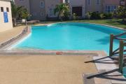 For sale a 2 bedroom duplex in a secure residence with shared swimming pool and tree-filled courtyard in Grand Gaube.