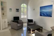 La Gaulette for sale villa divided into 4 two-bedroom apartments with commun swimming pool in a quiet residential area.