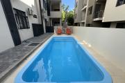 Flic en Flac for rent recent 3 bedroom apartment with shared swimming pool located in a quiet residential area.